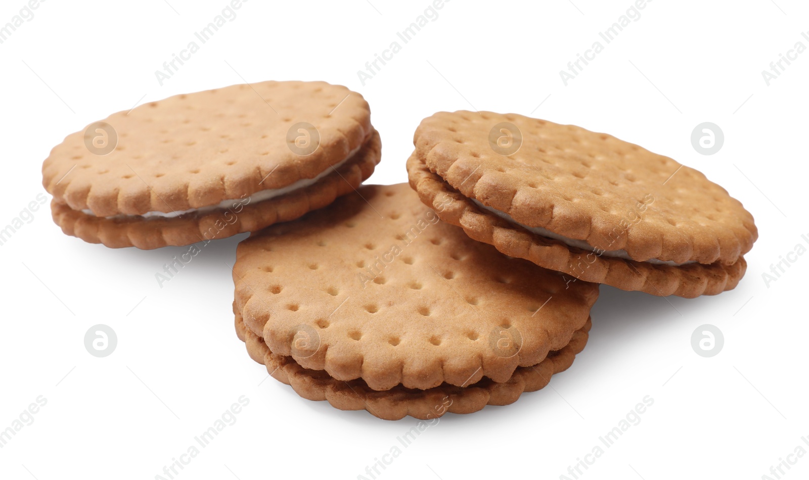 Photo of Three tasty sandwich cookies isolated on white