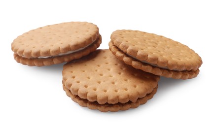 Photo of Three tasty sandwich cookies isolated on white