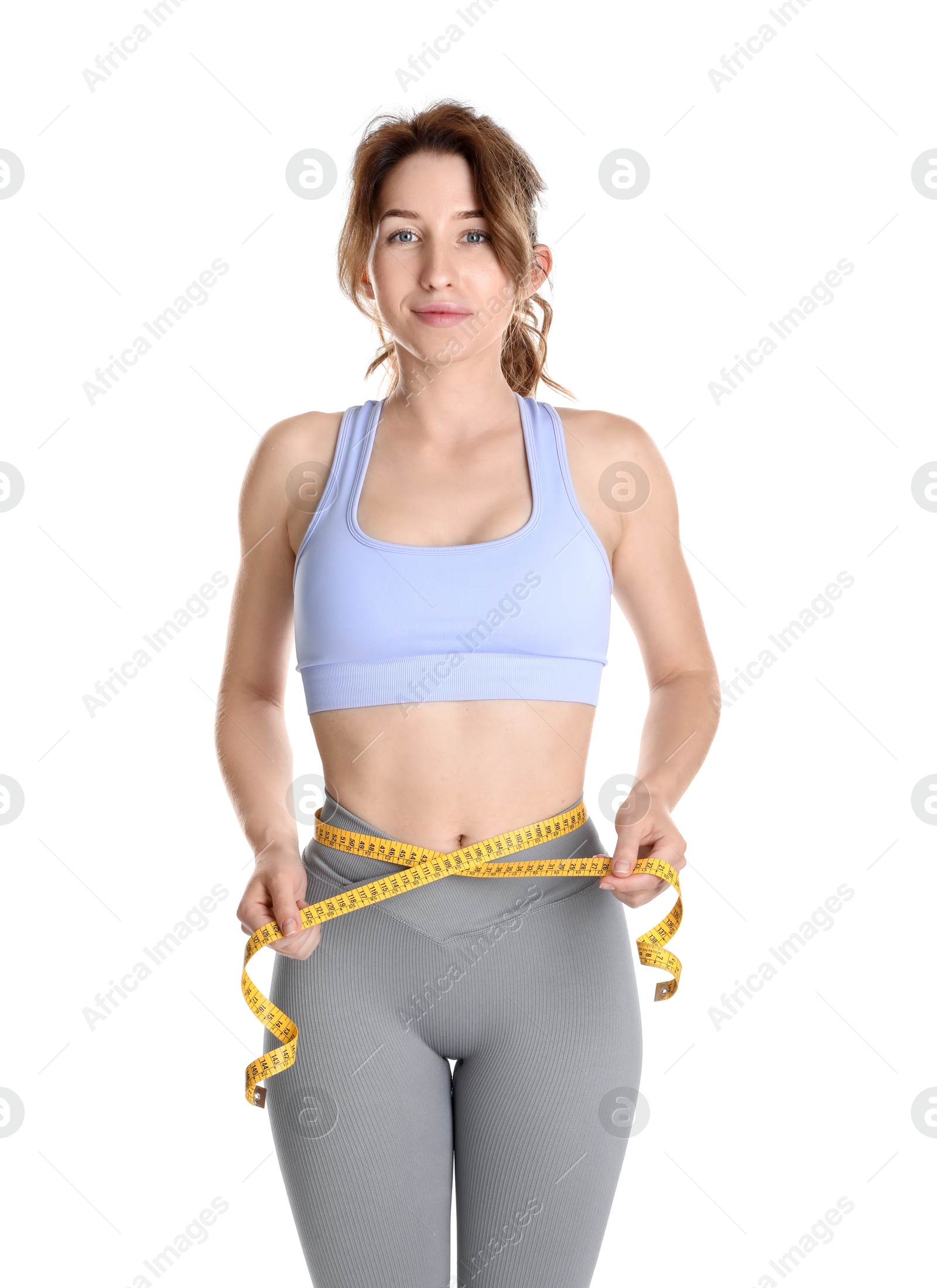 Photo of Woman with measuring tape showing her slim body against white background