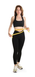 Woman with measuring tape showing her slim body against white background