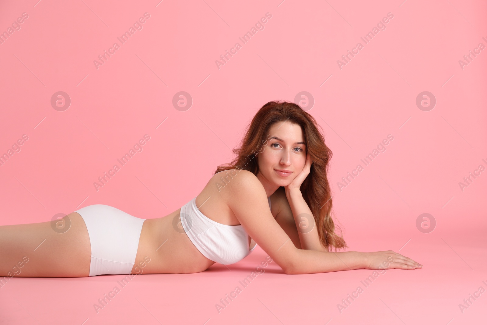 Photo of Woman with slim body posing on pink background