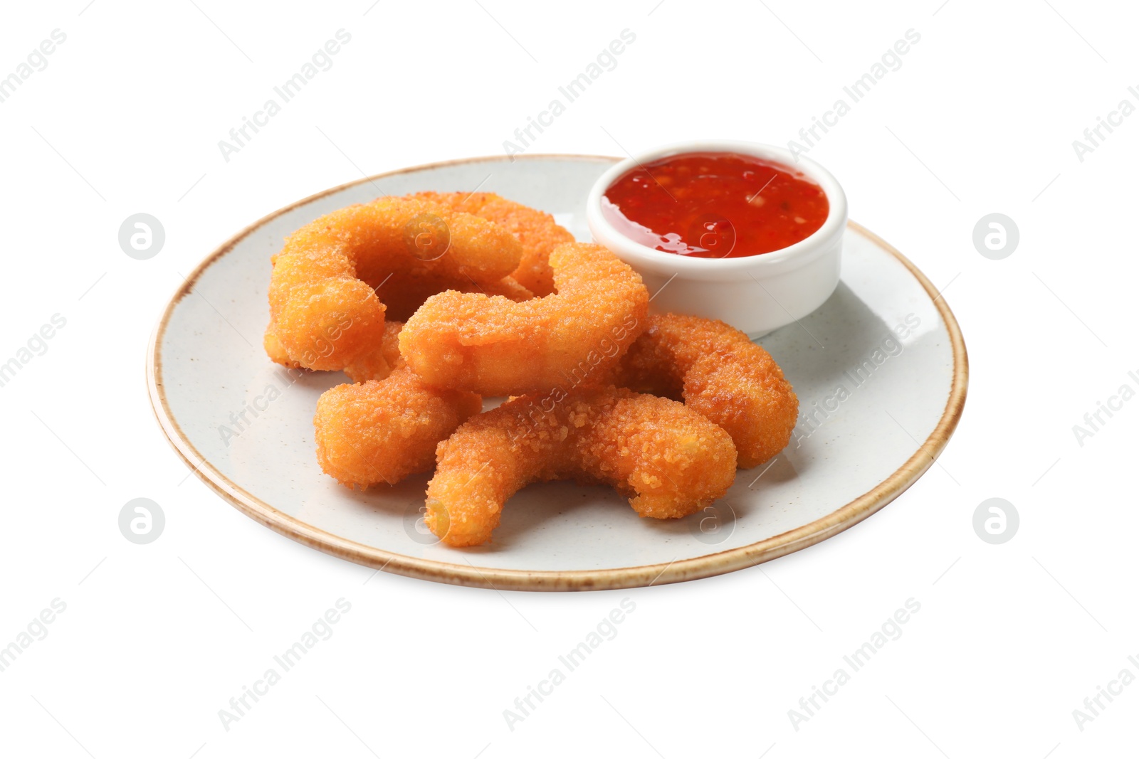 Photo of Tasty breaded fried shrimps and sauce isolated on white