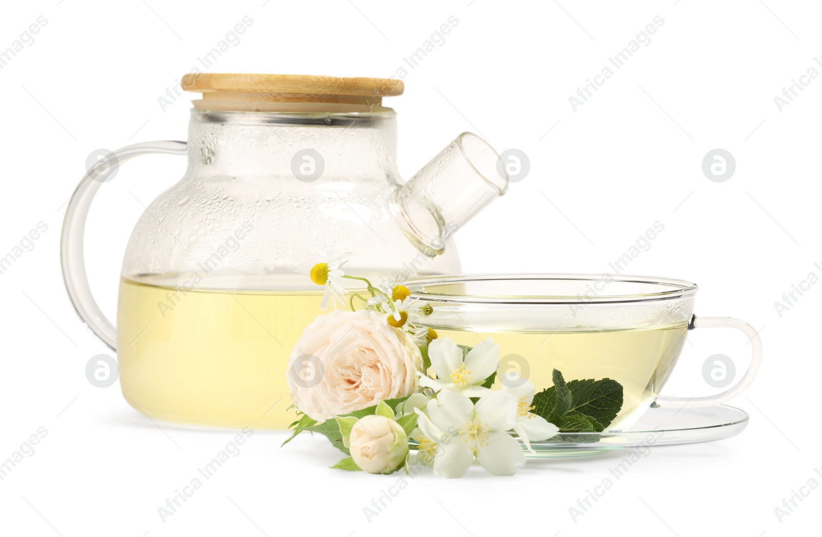 Photo of Aromatic herbal tea with different flowers and mint isolated on white