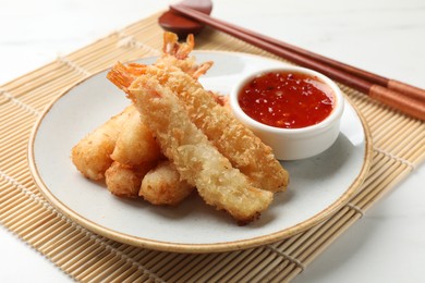 Delicious breaded fried shrimps served on white table