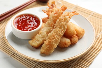 Delicious breaded fried shrimps served on white table