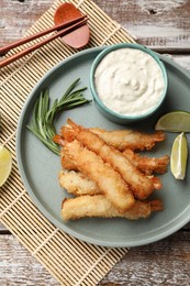 Delicious breaded fried shrimps served on wooden table, flat lay