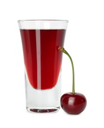 Photo of Shot glass of delicious cherry liqueur and juicy berry isolated on white