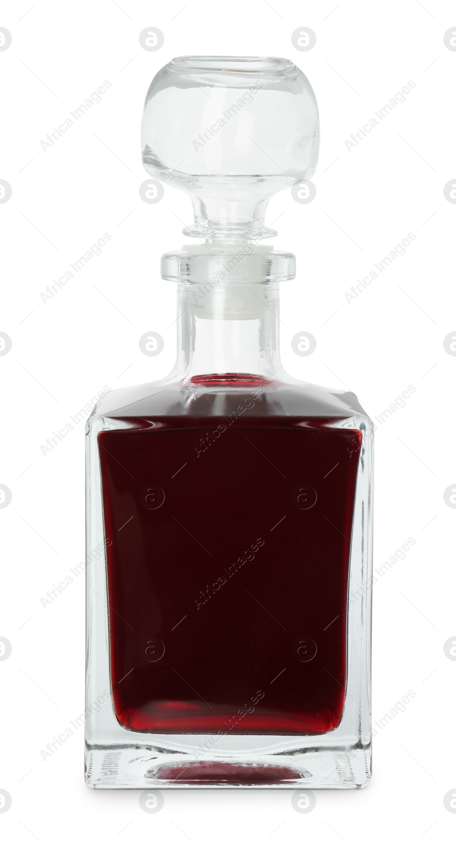 Photo of Bottle of delicious cherry liqueur isolated on white