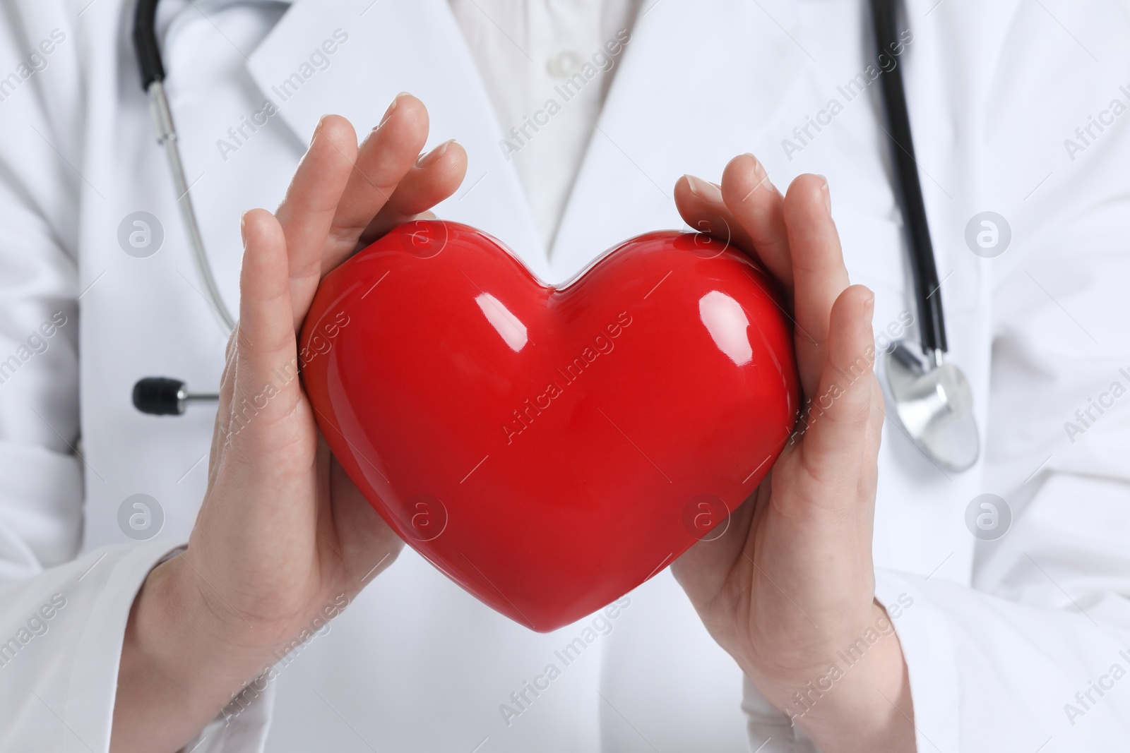 Photo of Doctor with stethoscope and red heart, closeup