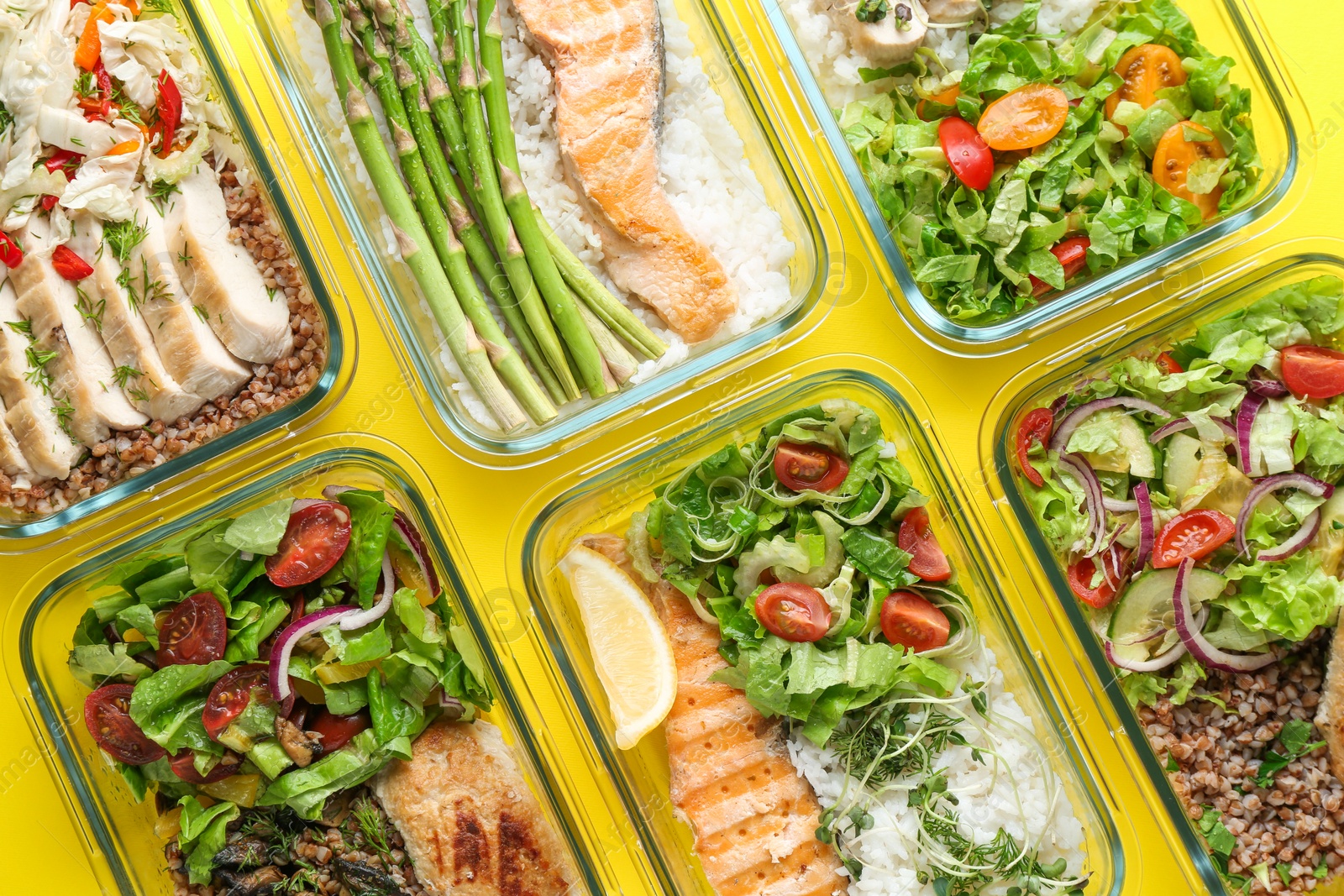 Photo of Healthy food. Different meals in glass containers on yellow background, flat lay