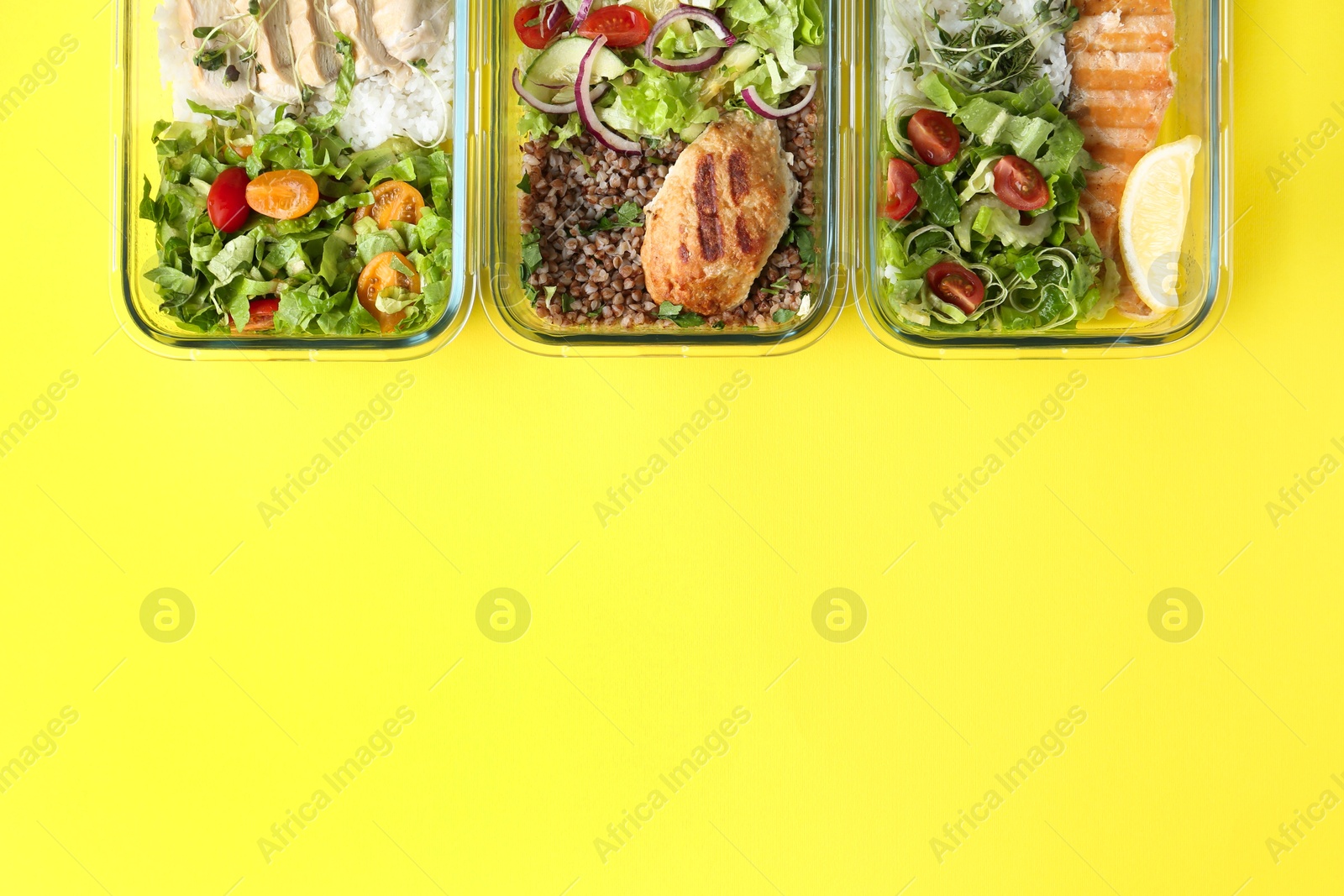 Photo of Healthy food. Different meals in glass containers on yellow background, flat lay. Space for text