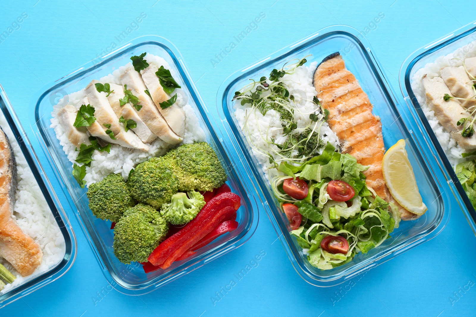 Photo of Healthy food. Different meals in glass containers on light blue background, flat lay