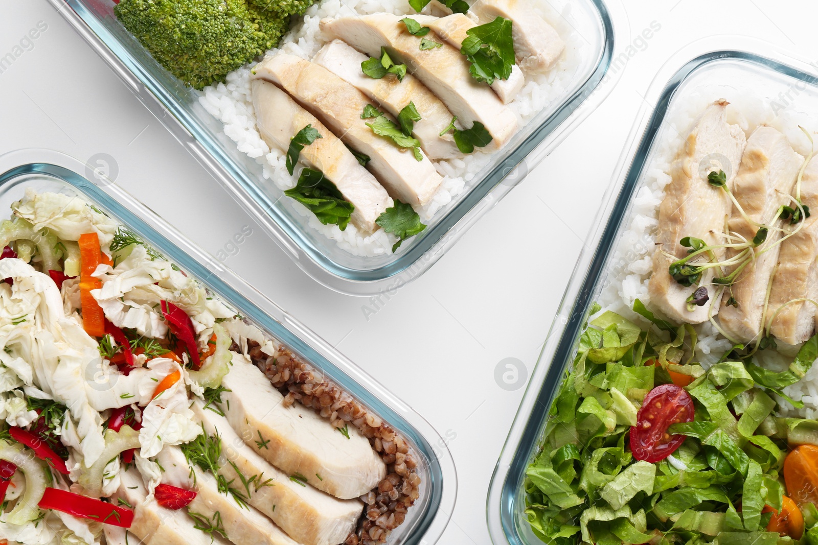 Photo of Healthy food. Different meals in glass containers on white background, flat lay