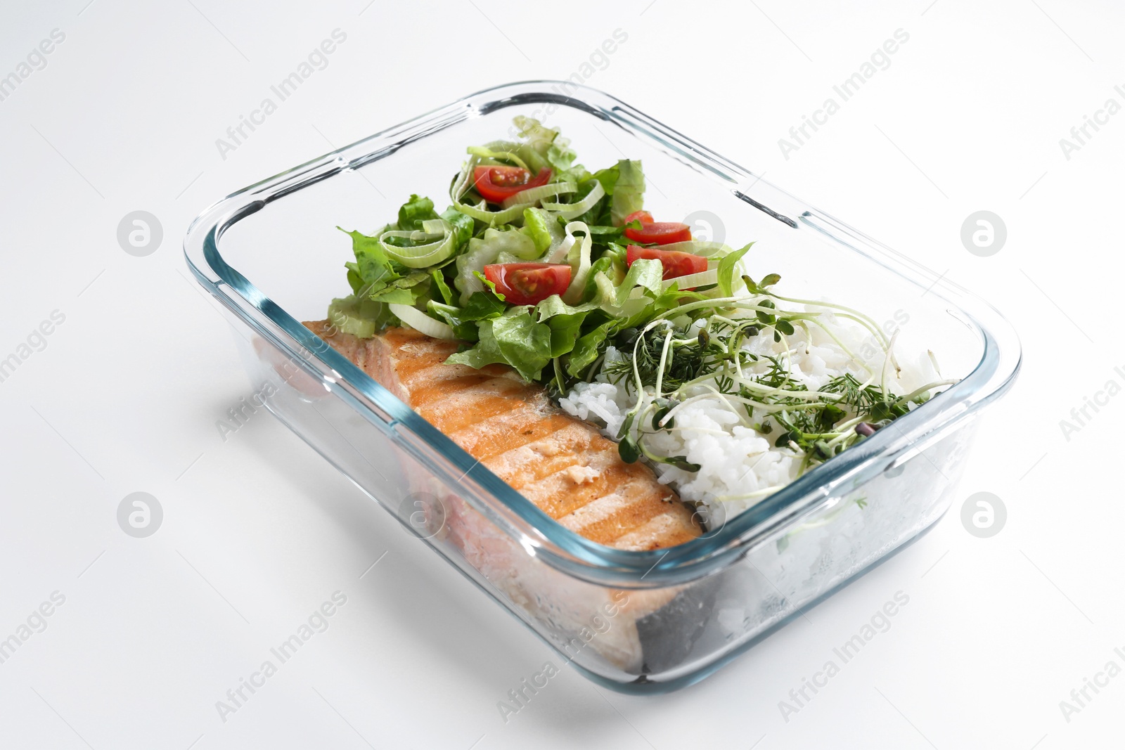 Photo of Healthy meal. Fresh salad, salmon and rice in glass container on white background