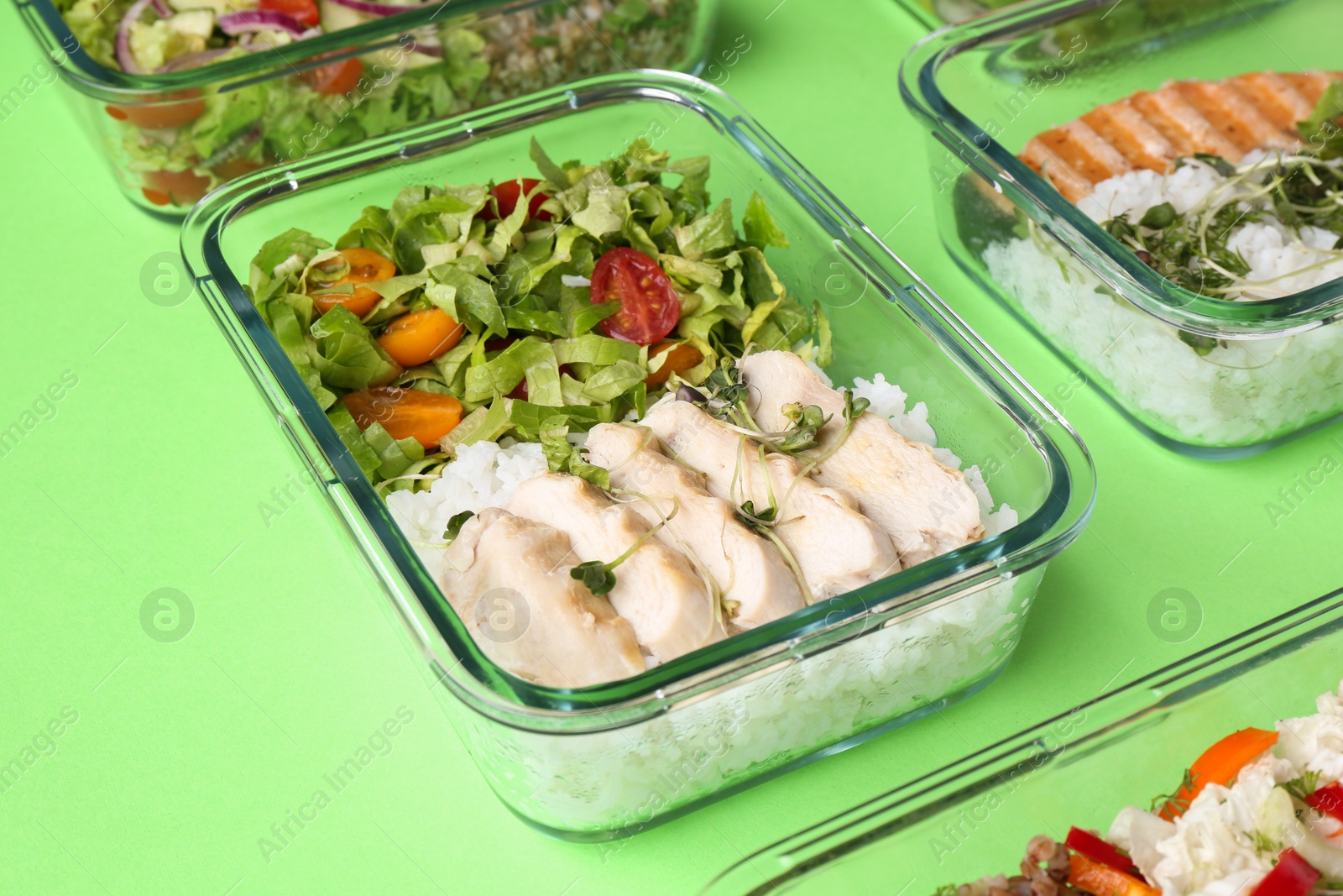 Photo of Healthy food. Different meals in glass containers on green background