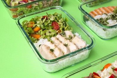 Healthy food. Different meals in glass containers on green background