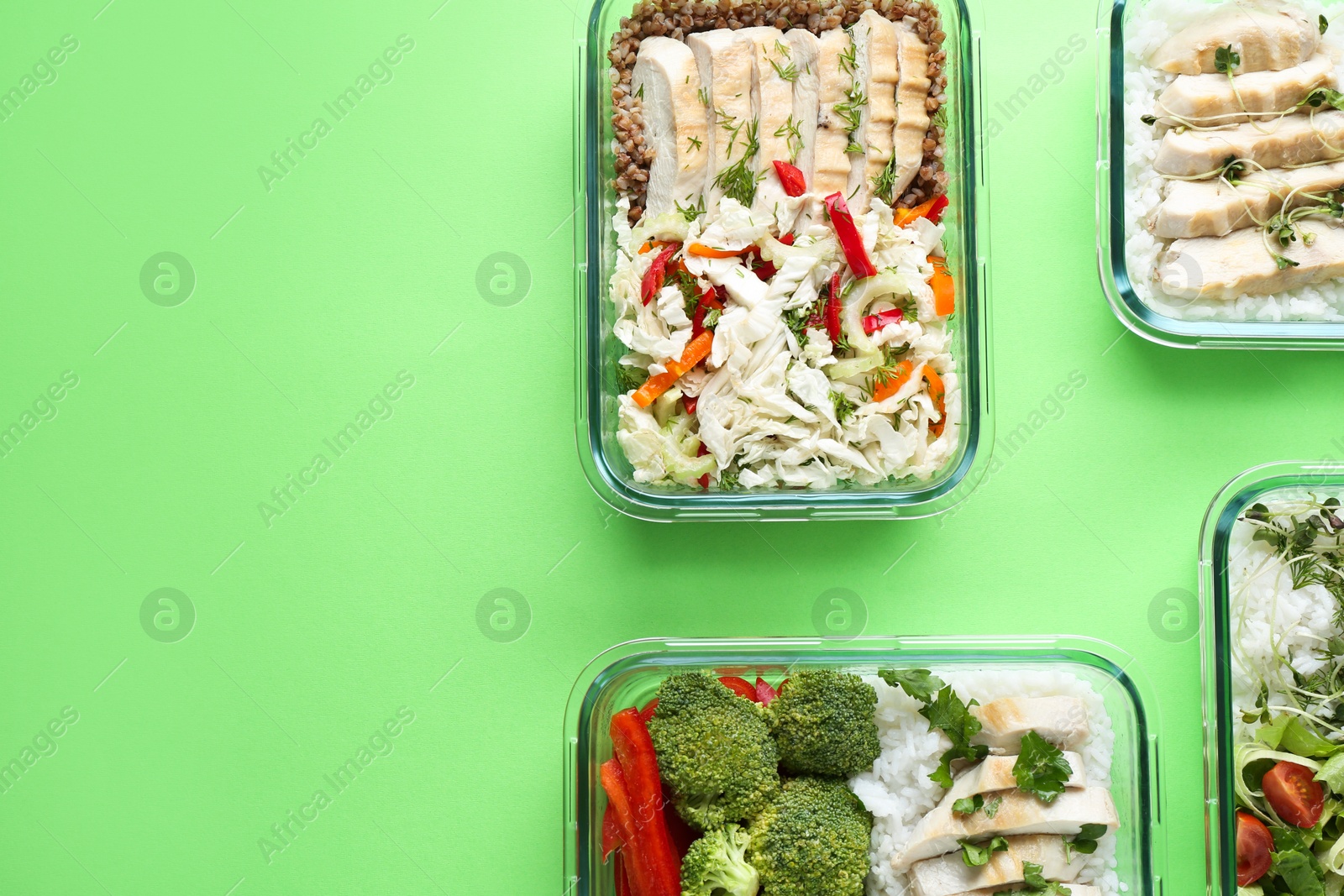 Photo of Healthy food. Different meals in glass containers on green background, flat lay. Space for text