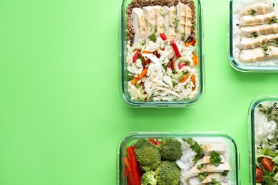 Healthy food. Different meals in glass containers on green background, flat lay. Space for text