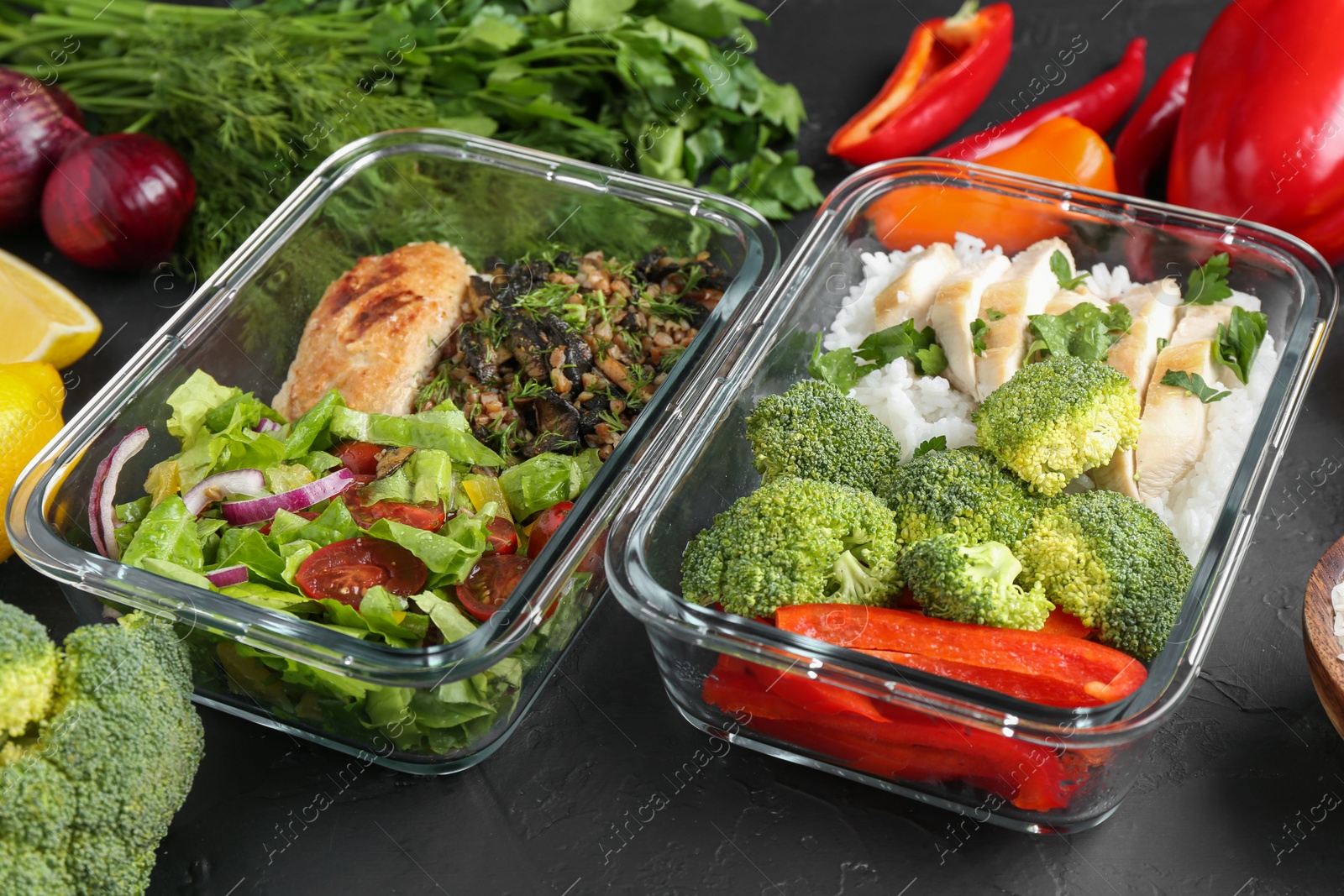 Photo of Healthy diet. Different meals in glass containers and products on black table
