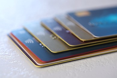 Plastic credit cards on table, closeup view
