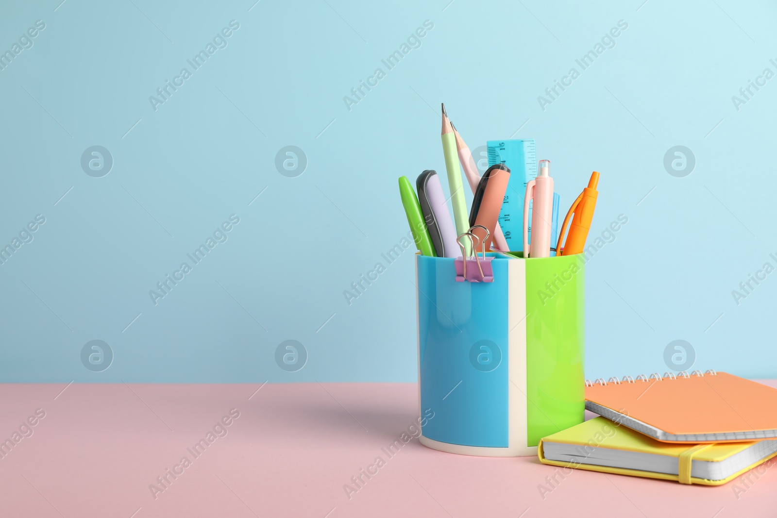 Photo of Different stationery on color background, space for text