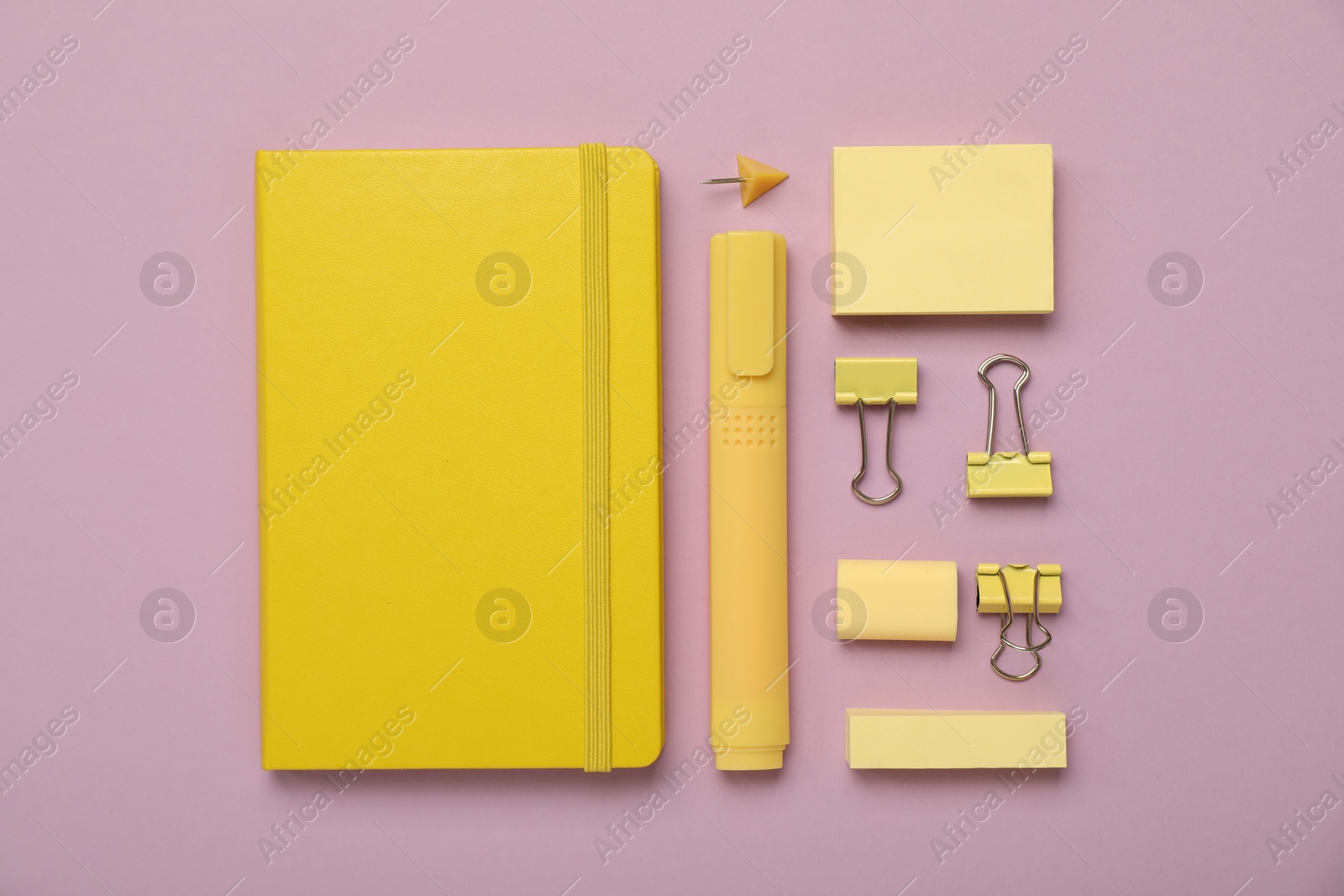 Photo of Flat lay composition with notebook and different stationery on violet background