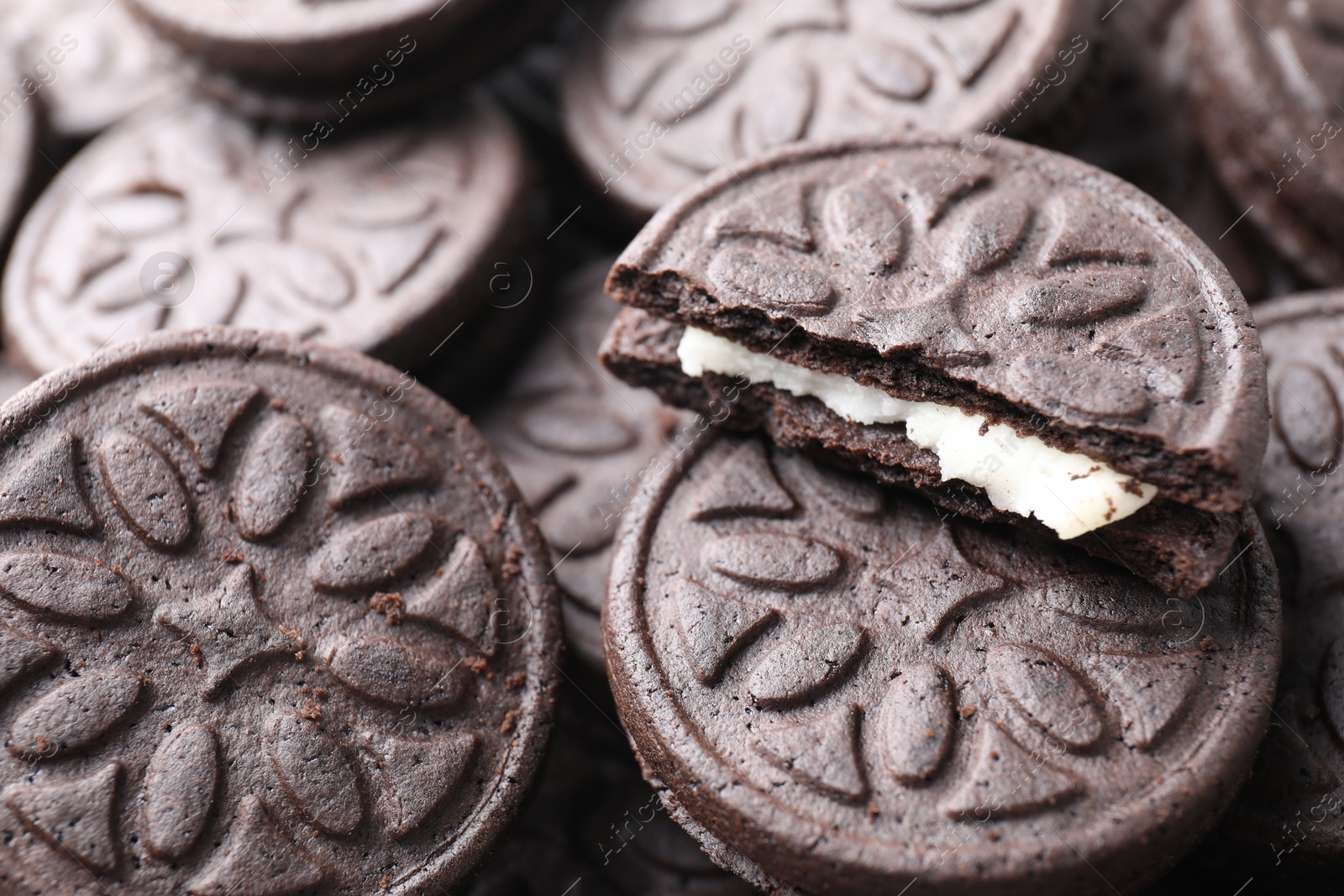 Photo of Tasty sandwich cookies as background, closeup view