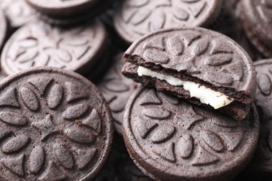 Tasty sandwich cookies as background, closeup view