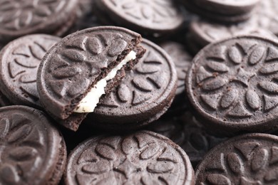 Photo of Tasty sandwich cookies as background, closeup view