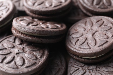 Photo of Tasty sandwich cookies as background, closeup view