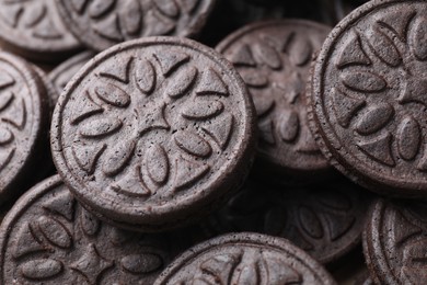 Tasty sandwich cookies as background, closeup view