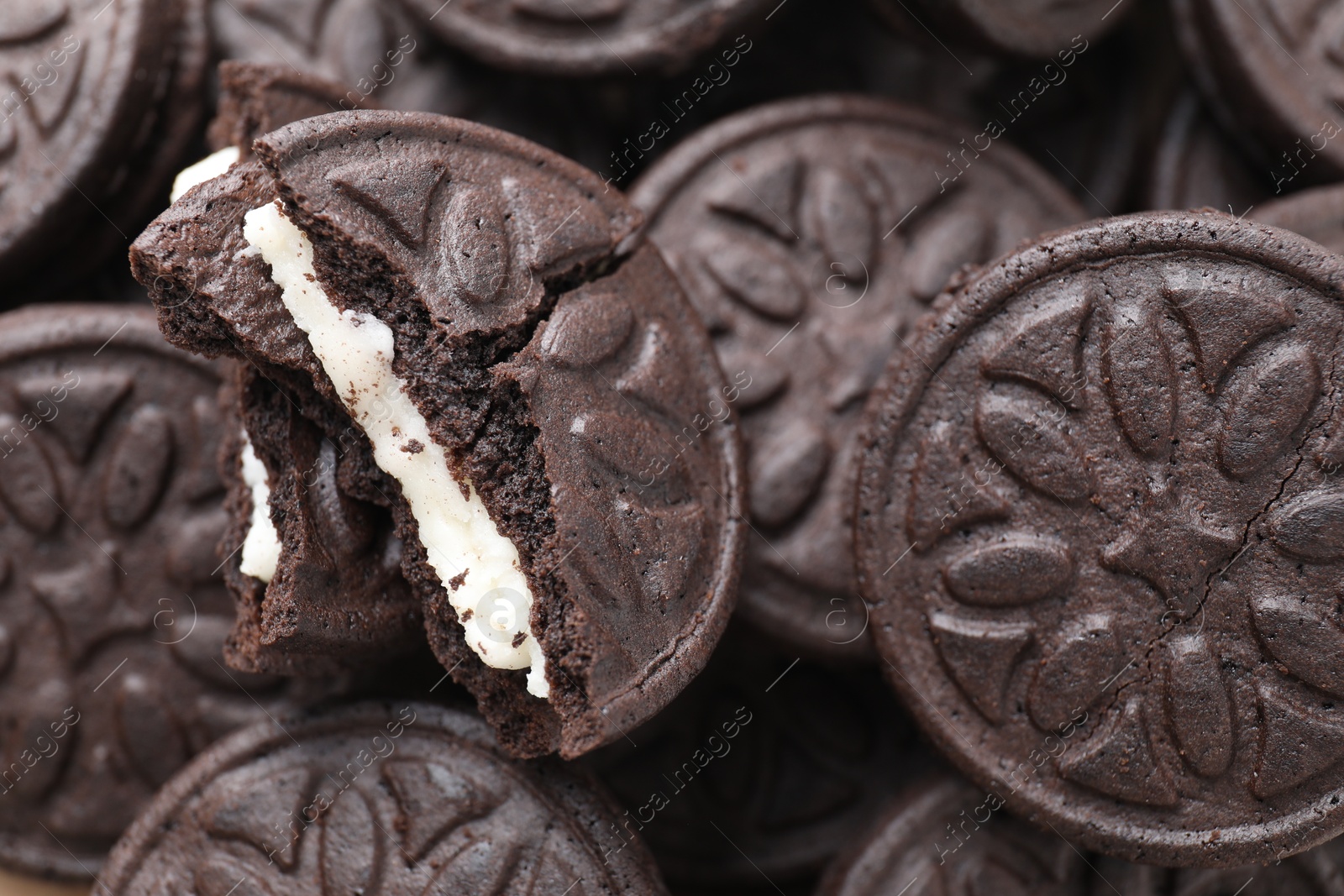 Photo of Tasty sandwich cookies as background, closeup view