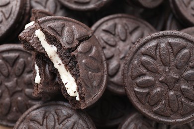 Tasty sandwich cookies as background, closeup view