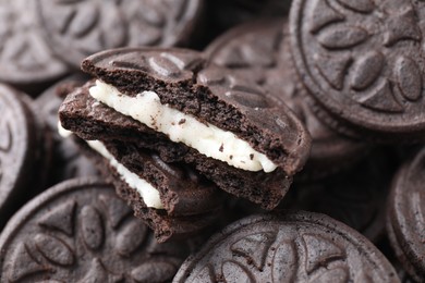 Photo of Tasty sandwich cookies as background, closeup view