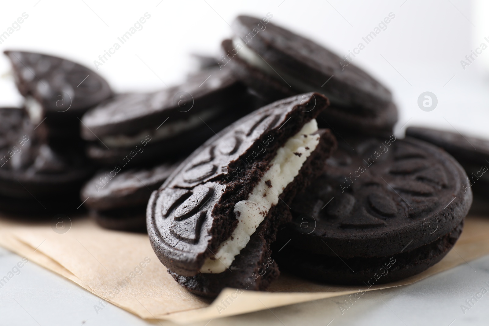 Photo of Many tasty sandwich cookies on table, closeup