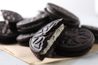 Many tasty sandwich cookies on table, closeup