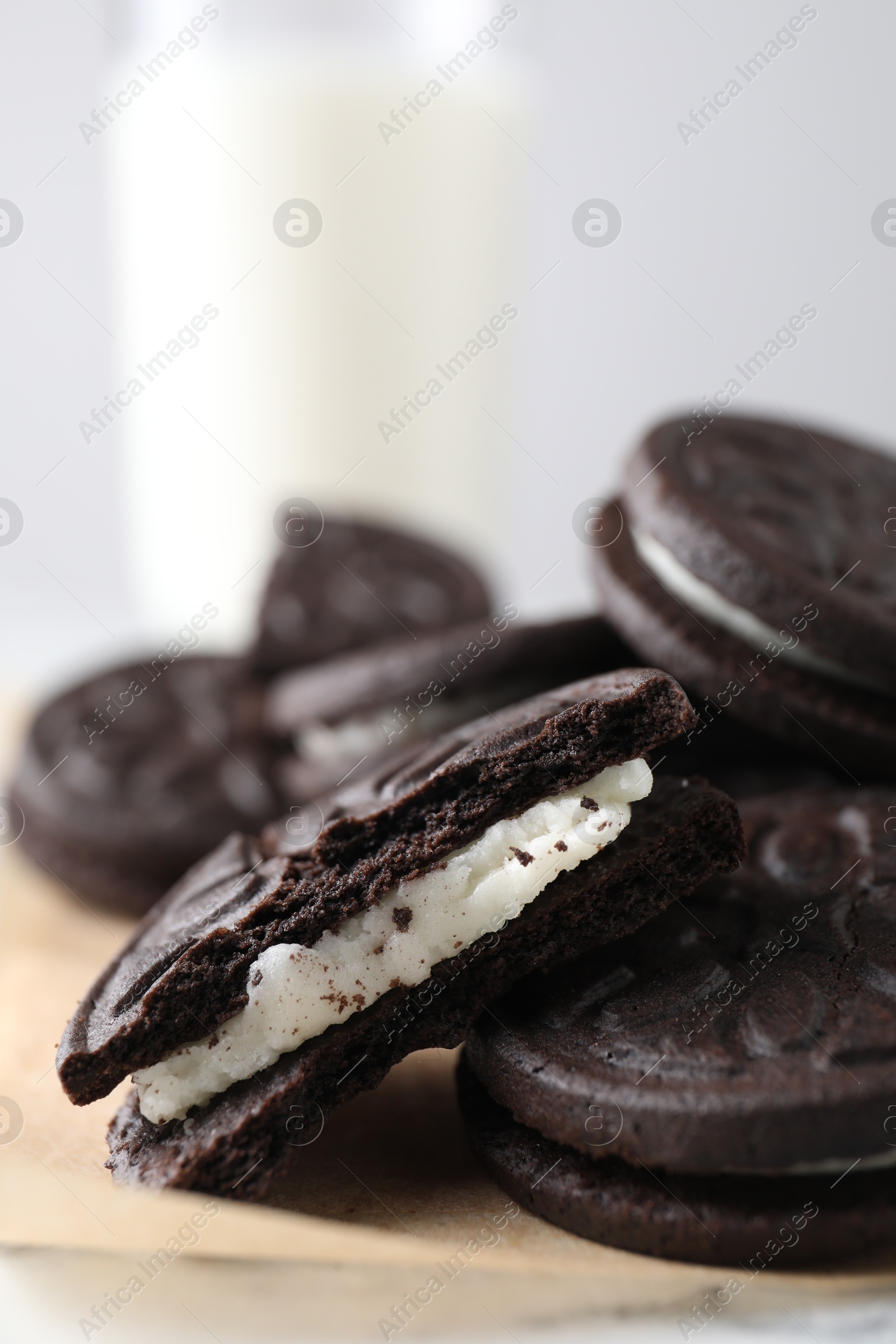 Photo of Many tasty sandwich cookies on table, closeup