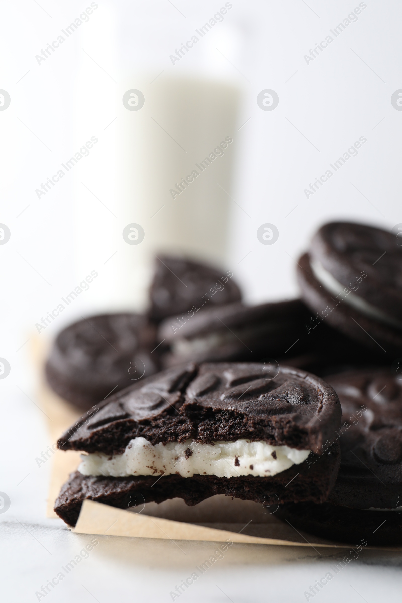 Photo of Many tasty sandwich cookies on table, closeup