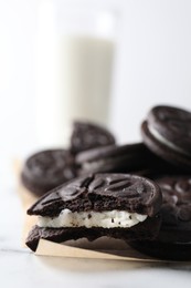 Photo of Many tasty sandwich cookies on table, closeup