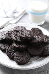 Photo of Many tasty sandwich cookies on light grey table