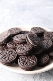 Photo of Many tasty sandwich cookies on light grey table