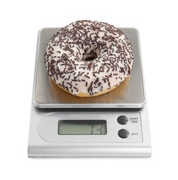 Photo of Kitchen scale with donut isolated on white