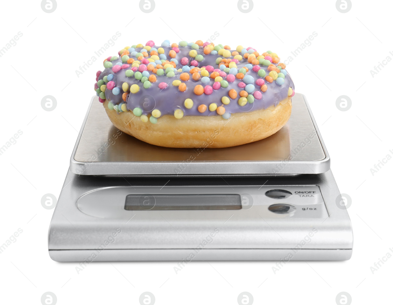 Photo of Kitchen scale with donut isolated on white