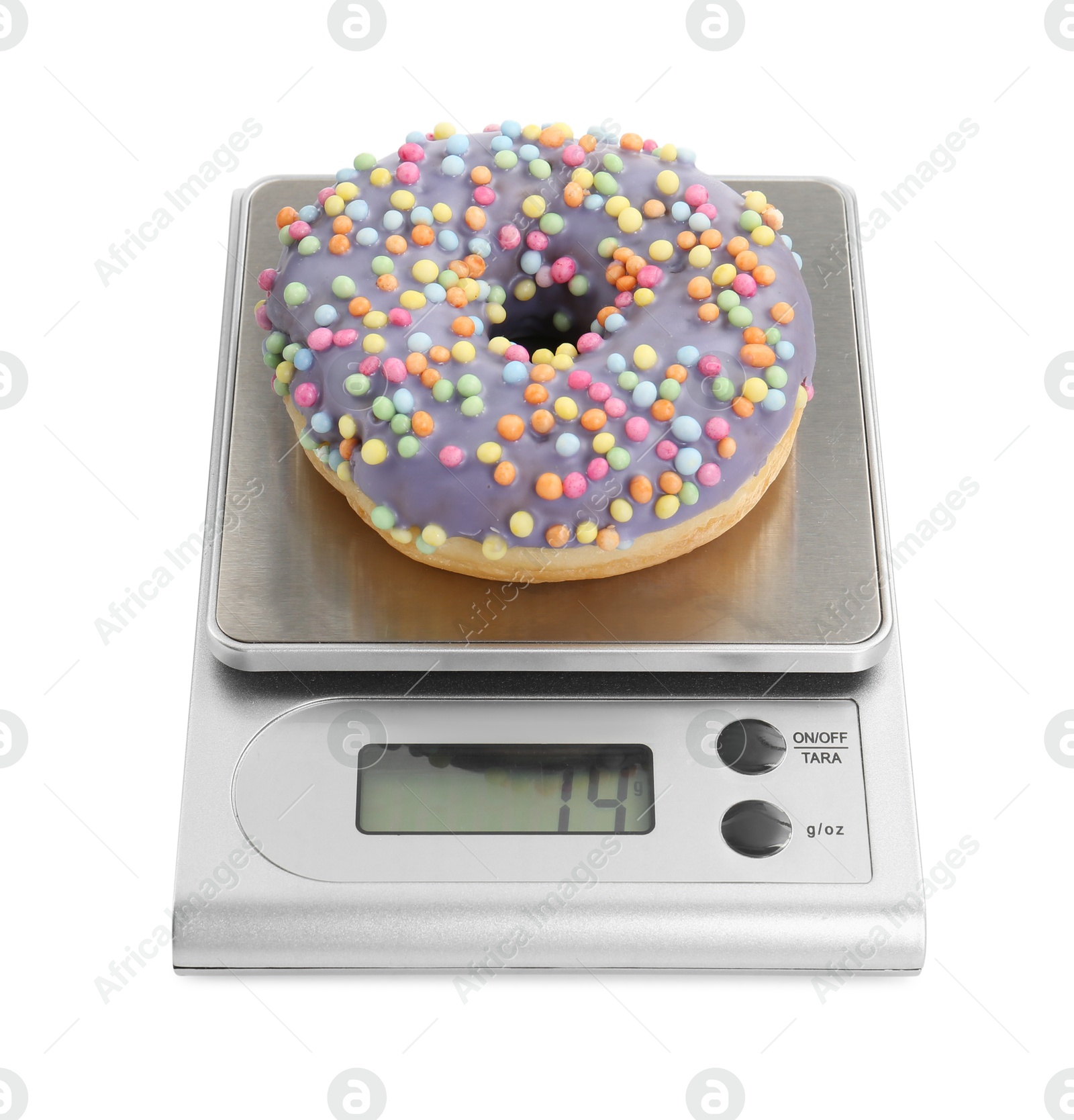 Photo of Kitchen scale with donut isolated on white