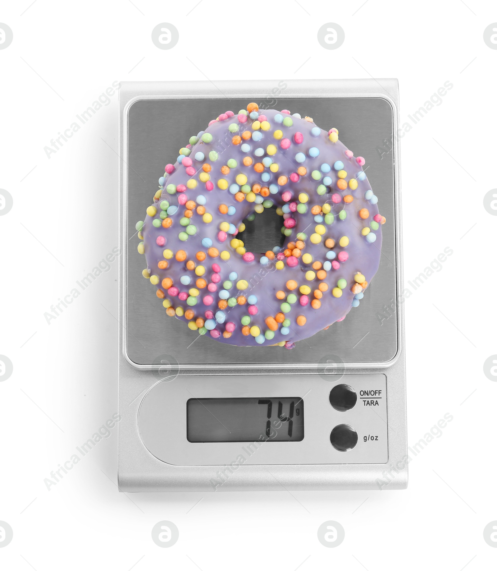 Photo of Kitchen scale with donut isolated on white, top view