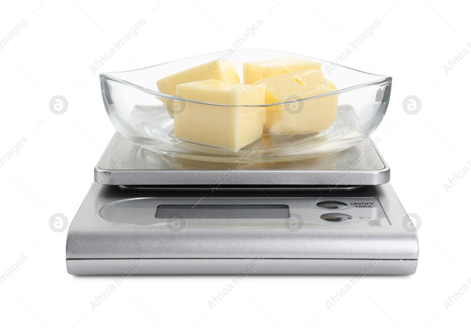 Photo of Kitchen scale with bowl of butter isolated on white