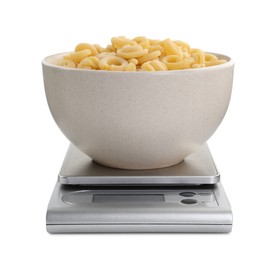 Kitchen scale with bowl of pasta isolated on white