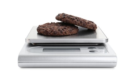 Kitchen scale with chocolate cookies isolated on white