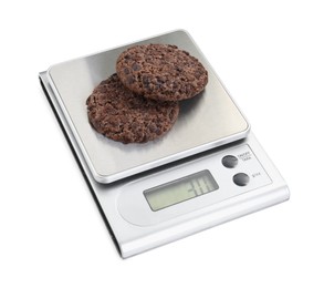 Kitchen scale with chocolate cookies isolated on white