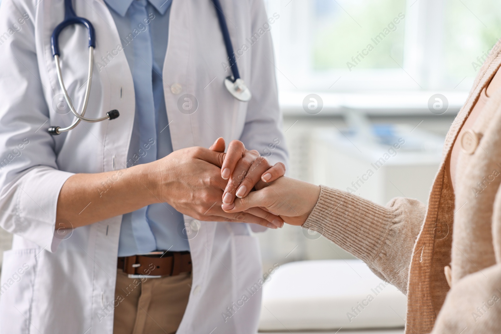 Photo of Professional doctor working with patient in hospital, closeup